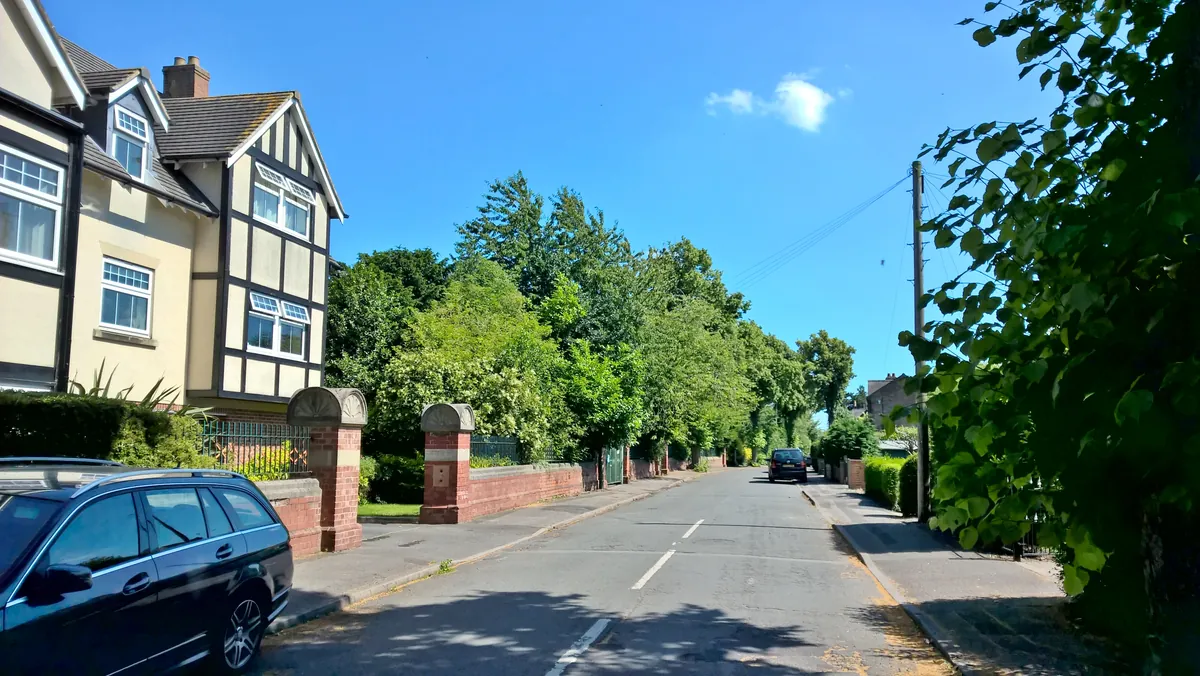 A mock Tudor house beside a leafy road on Shaftesbury Avenue in Burton Joyce