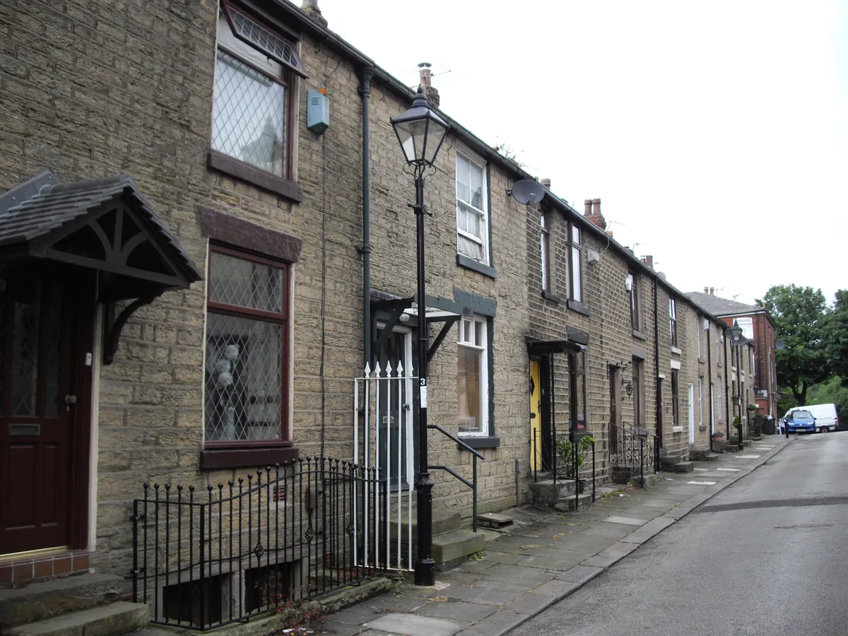 Stone terraced cottages with small porches on Duncan Street in Horwich
