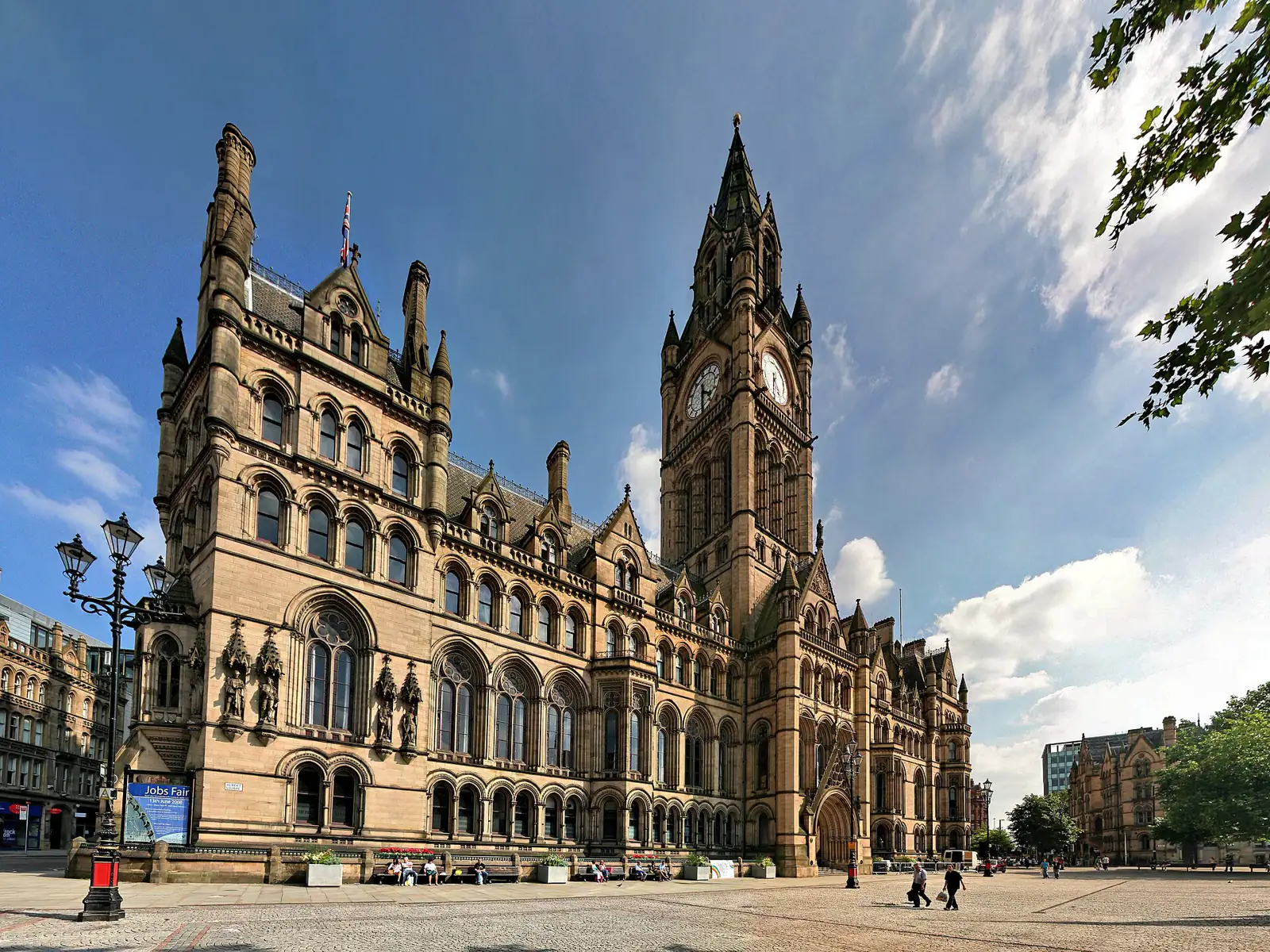 Manchester Town Hall's clock tower against a blue sky